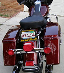 red motorcycle with Illinois Sheriffs Assoc license plate frame example
